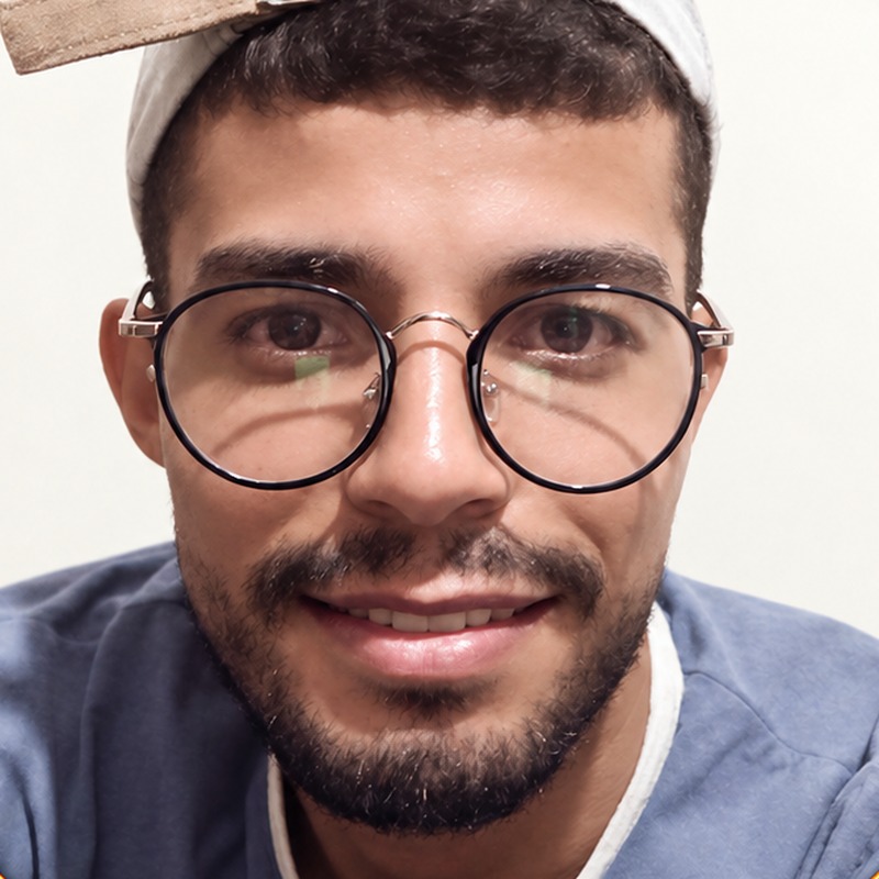Mohcen Leader, founder of CrochetSmith, wearing glasses and a cap.